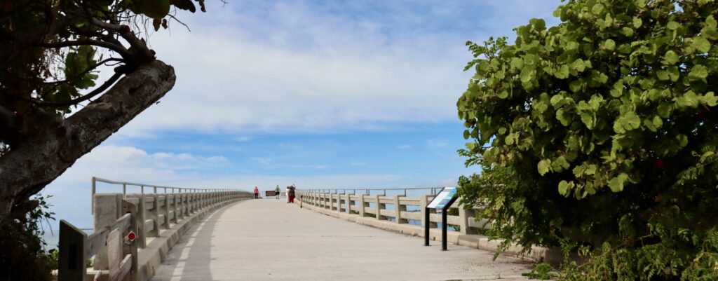 Walking onto the Bahia Honda Bridge in Florida Keys, with a view of the open water stretching into the distance, creating a serene and isolated experience