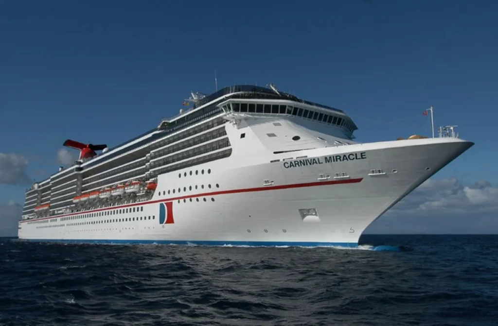 Carnival cruise ship sailing through vibrant waters with a lively atmosphere, featuring colorful decks, fun-filled onboard activities, and the excitement of a carefree vacation.