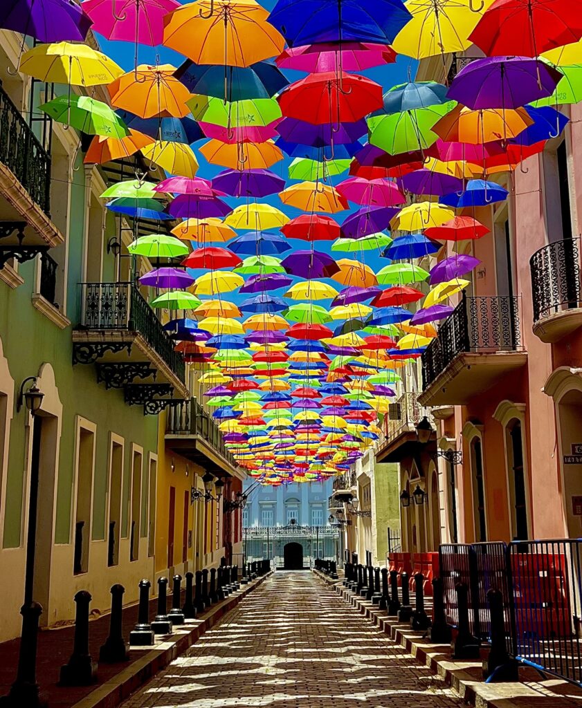 Old San Juan - umbrella alley. There are colorful umbrellas as the roof above the street and is very beautiful