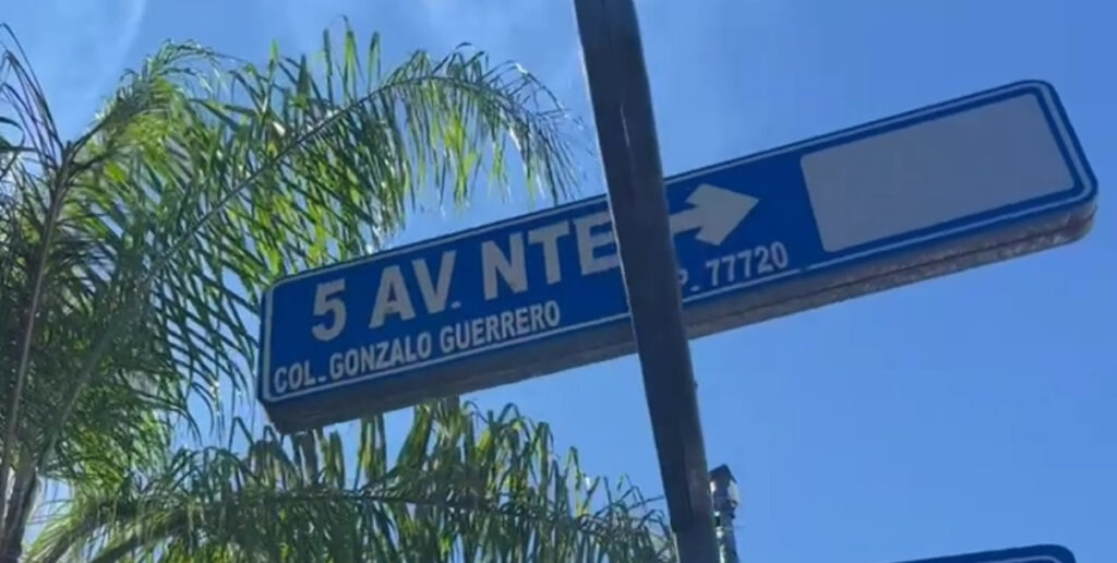 Close-up of the vibrant 5th Avenue sign in Playa del Carmen, Mexico, highlighting the bustling heart of shopping, dining, and nightlife in the Riviera Maya